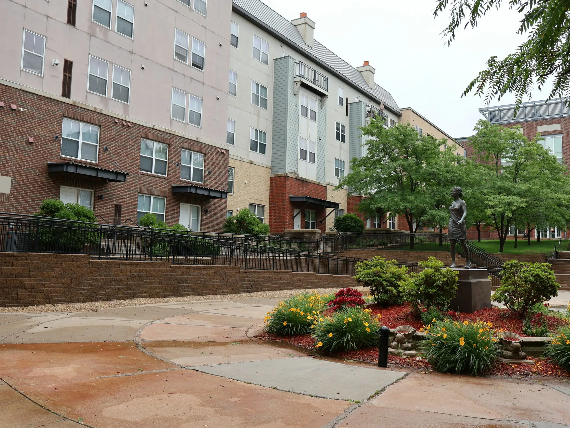 Freshly maintained apartment courtyard garden with trimmed hedges