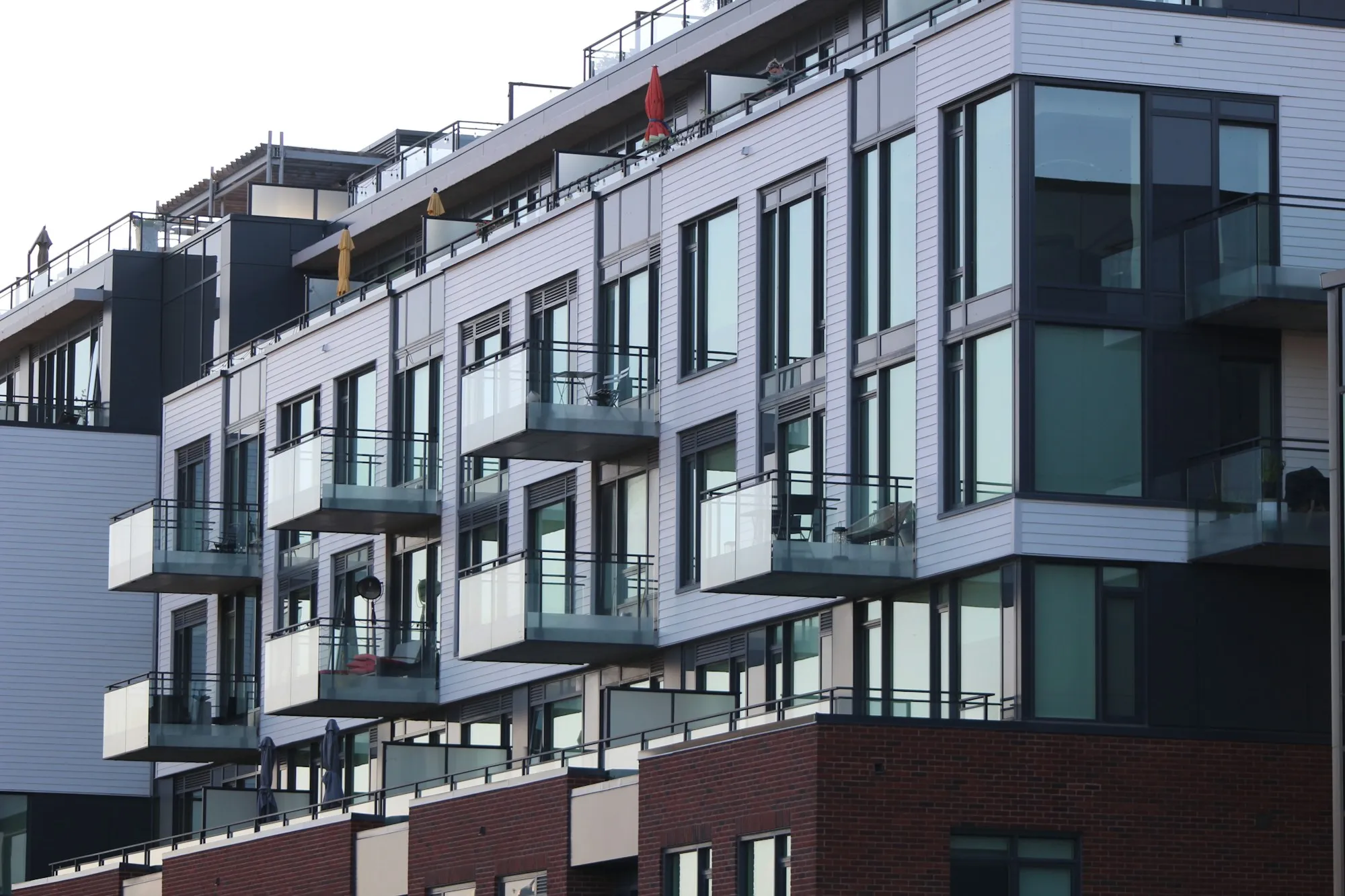 Modern apartment facade with balconies and large windows